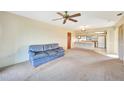 Living room with open kitchen and access to hallway and bathroom at 4260 Placida Rd # 15D, Englewood, FL 34224