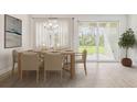 Light-filled dining room with sliding glass doors leading to the backyard at 15952 Crofton Springs Way, Port Charlotte, FL 33953