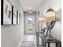 Bright entryway with decorative lamps and art at 107 Santarem Cir, Punta Gorda, FL 33983