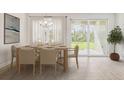 Elegant dining room with a large table, access to backyard, and hardwood floors at 16024 Crofton Springs Way, Port Charlotte, FL 33953