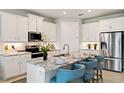 Modern kitchen featuring stainless steel appliances and granite countertops at 16130 Highgate St, Port Charlotte, FL 33953