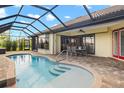 Inviting kidney-shaped pool with patio and seating area at 1736 Suzi St, Punta Gorda, FL 33950