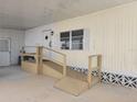 Exterior view of mobile home with ramp access at 5524 Holiday Park Blvd, North Port, FL 34287