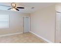 Bright and airy living room with tile flooring and neutral walls at 8302 Aero Ave, North Port, FL 34287