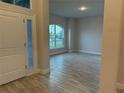 Bright entryway with tile floors and a large window at 10225 Winnipeg St, Port Charlotte, FL 33981
