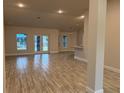 Spacious living room with tile floors and access to the backyard at 10225 Winnipeg St, Port Charlotte, FL 33981