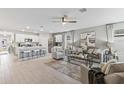 Open floor plan with living room, kitchen island, and neutral decor at 5096 Schubert Trl, North Port, FL 34287