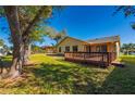 Spacious backyard with a large deck, perfect for entertaining at 1327 Abscott St, Port Charlotte, FL 33952