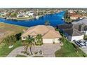 Aerial view of single Gathering home and neighborhood with water access at 3736 Bal Harbor Blvd, Punta Gorda, FL 33950