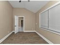 Bright bedroom with wood-look flooring and neutral walls at 2387 Tamarind St, Port Charlotte, FL 33948