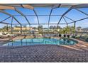 Enclosed pool and patio area with canal views at 18491 Hottelet Cir, Port Charlotte, FL 33948
