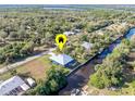 Aerial view showing a house by the water with a canal at 28492 Royal Palm Dr, Punta Gorda, FL 33982