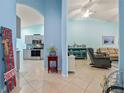 View of living room and kitchen from entryway at 3820 Tripoli Blvd # 42, Punta Gorda, FL 33950