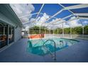 Relaxing pool area with covered patio and hot tub at 4132 Michel Tree St, Port Charlotte, FL 33948