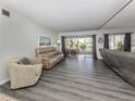 Living room with gray flooring and patio access at 437 Cerromar Ln # 312, Venice, FL 34293