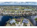 Stunning aerial view of home in waterfront community with multiple lakes and a golf course at 500 Andora Dr, Punta Gorda, FL 33950