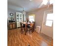 Small dining area with wood table and four chairs at 525 Parkwood Ave, North Port, FL 34287