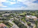 Aerial view of condo community with pool and tennis courts at 255 W End Dr # 2412, Punta Gorda, FL 33950