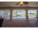 Brick paved patio with screened pool and view of the backyard at 7529 Coral Tree, Punta Gorda, FL 33955