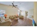 Spacious living room with wood-look floors and lots of natural light at 8382 Creekview Ln, Englewood, FL 34224