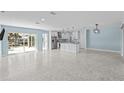 Open concept living room and kitchen with modern finishes at 174 Severin Se Rd, Port Charlotte, FL 33952