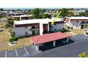 Exterior view of condo building showcasing the unit's location and carport at 311 Garvin St # 309D, Punta Gorda, FL 33950