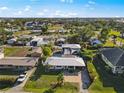 Wide aerial view showing the home's neighborhood and surrounding houses at 429 W Ann St, Punta Gorda, FL 33950