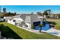 Single-story home with gray roof and landscaped yard at 4365 Aladdin Ave, North Port, FL 34287