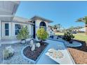 Attractive walkway to front entrance with landscaping at 4365 Aladdin Ave, North Port, FL 34287