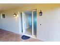 Condo entry with door and tiled flooring at 1 Colony Point Dr # A8, Punta Gorda, FL 33950