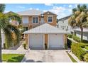 Two-story building with attached garages, showcasing a well-maintained exterior at 2002 Bal Harbor Blvd # 1822, Punta Gorda, FL 33950