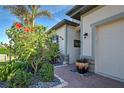 Inviting entryway with brick walkway and potted plants at 2108 La Palma Ave, Port Charlotte, FL 33953