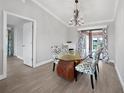 Dining room with glass table and access to the backyard at 22481 Vale Ave, Punta Gorda, FL 33980