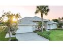 White garage door and a nicely landscaped front yard at 251 Viceroy Ter, Port Charlotte, FL 33954