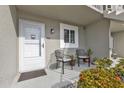 Condo entrance with chairs and landscaping at 3310 Loveland Blvd # 701, Punta Gorda, FL 33980