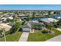 Bird's-eye view of a canal-front home in a residential neighborhood at 414 Norma Ct, Punta Gorda, FL 33950