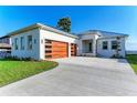 Modern home with a two-car garage and a waterfront view at 112 Northshore Ter, Punta Gorda, FL 33980