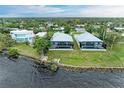 Two waterfront homes with private pools and lush landscaping at 116 Northshore Ter, Punta Gorda, FL 33980