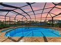 Relaxing screened-in pool and spa overlooking the canal at 1245 Whippoorwill Ct, Punta Gorda, FL 33950