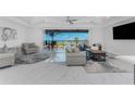 Bright living room with water views and comfy seating at 1425 Park Beach Cir # 124, Punta Gorda, FL 33950