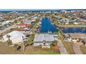 Wide aerial view of a waterfront property with private dock at 1640 Montia Ct, Punta Gorda, FL 33950