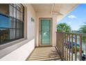 Private balcony with teal door access to condo at 175 Kings Hwy # 738, Punta Gorda, FL 33983