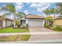 Front view of a single-Gathering home with a brick driveway at 19119 Mangieri St, Venice, FL 34293