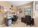 Bright home office featuring a desk, chair, and ample natural light at 19119 Mangieri St, Venice, FL 34293