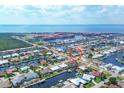 Aerial view of waterfront home in a residential community at 195 Bayshore Ct, Punta Gorda, FL 33950