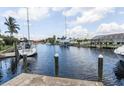 Scenic view of a canal with boats and waterfront homes at 195 Bayshore Ct, Punta Gorda, FL 33950