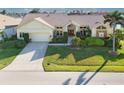 Beautiful waterfront home with tile roof and lush landscaping at 2427 St Davids Island Ct, Punta Gorda, FL 33950