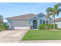 Charming light blue house with two-car garage at 25361 E Lenox Cir, Punta Gorda, FL 33950