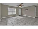 Spacious living area featuring neutral walls and tile flooring at 3450 Moravia Ave, North Port, FL 34286