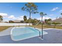 Inviting kidney-shaped swimming pool in a backyard setting at 3450 Moravia Ave, North Port, FL 34286